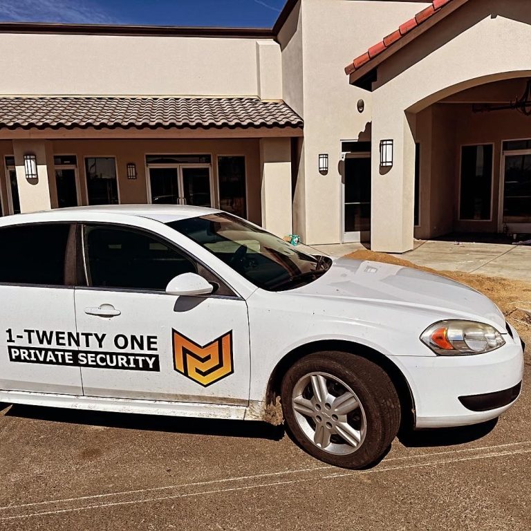 Marked 1-Twenty One Security patrol vehicle at a commercial property