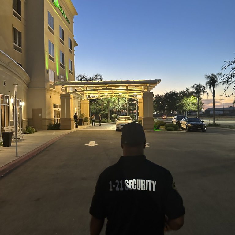 Security officer patrolling the exterior of a Bakersfield hotel